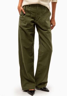 R13 showcases its sustainable side with these wide-leg trousers. In an olive green colourway, they're made from Japanese surplus loose military fabric. 100% Cotton Machine Wash, Hang Dry Made in Italy Model is 5’8” and wearing a size 24. Runs large, we recommend sizing down one size from your usual size. Model’s Measurements: 26” waist 34” hips 34" bust Bohme Olive Wide Leg Pants, Luxury Olive Trousers, Luxury Olive Bottoms For Workwear, Olive Green Kakhi Pants, Olive Green Pencil Pants, Bohme Olive Pants, Luxury Olive Bottoms For Spring, Olive Low Rise Pants, Cheap Olive Bottoms With Pockets