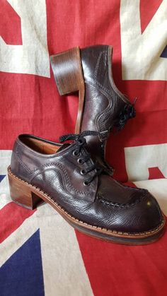 "Beautiful pair of Vintage early 70s Ravel shoes which are made in Italy. In a very dark brown and a uk size 8,euro 42,USA 9. When the British subculture was at it's most finest with the Mods,skinheads,soul boys,smoothies,reggae,bootboys etc all taking centre stage,these beauties would have appealed to the style conscious without a doubt. As you can see from the sole,not much wear at all,the uppers look amazing to with just minimal signs of wear. Wooden stacked heel measures just over 2&1/4\ 70s Fashion Shoes, British Subculture, 70s Platform Shoes, 70s Shoes, 60s Men, Mens Platform Shoes, Hardy Amies, Football Casuals, Shoes Ads