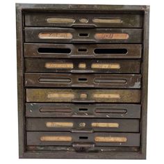 an old metal filing cabinet with lots of drawers