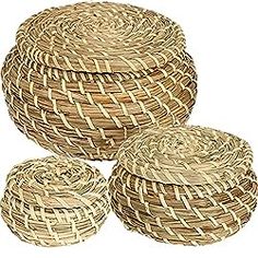 three round woven baskets sitting next to each other