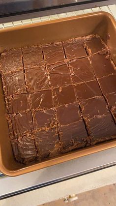 a pan filled with brownies sitting on top of a counter