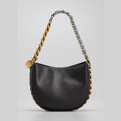 Stella McCartney shoulder bag in faux-leather. Two-tone chain shoulder strap woven onto bag; hanging engraved charm. Detachable, adjustable shoulder strap, 22.6" drop. Open top with snap closure. Interior, one slip pocket. Approx. 6.9"H x 8.5"W x 2.8"D. "Frayme" is made in Italy. Designer Shoulder Bag With Chain Detail, Designer Shoulder Bag With Chain, Luxury Shoulder Bag With Chain In Crossbody Style, Modern Shoulder Bag With Chain Strap, Leather Shoulder Bag With Chain Link For Everyday, Luxury Chain Shoulder Bag Crossbody, Luxury Chain Crossbody Shoulder Bag, Leather Chain Link Shoulder Bag For Everyday, Luxury Chain Shoulder Crossbody Bag