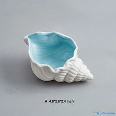 a blue and white bowl sitting on top of a table