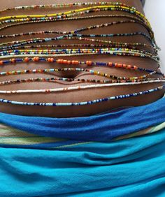 Waist beads have been worn by women for a very long time. They make a woman feel feminine and beautiful. Other reasons include; * Used as a waist control. They help shrink the waist as well as maintain figure. If the beads get tighter as you continue using them, you will know you are adding weight. Same case to losing weight if they become lose. *Some women use the beads to keep matters romantic hot. They adorn the beads to make their men happy. * The beads are used to make the waist noticeable. Spiritual Beaded Waist Beads For Beach, Spiritual Round Waist Beads For Beach, Blue Colorful Waist Beads As Gift, Blue Beaded Waist Beads As Gift, Spiritual Multicolor Waist Beads With Tiny Beads, Bohemian Tiny Beads Waist Beads For Festival, Blue Waist Beads With Spacer Beads As Gift, Blue Round Beads Waist Beads For Gift, Blue Waist Beads Gift