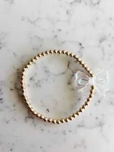 4mm 14k gold filled bracelet with bow bead Gold Charm Bracelet With Round Beads For Party, Dainty Gold Stretch Bracelet As Gift, Gold Stretch Bracelet, 14k Gold Filled, Gift, Elegant Gold Stretch Bracelet Gift, Bow Bracelet, Aesthetic Jewelry, Cute Cute, Star Bracelet, Cute Bow