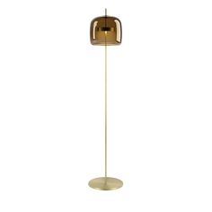 the floor lamp is gold and has a round base with a light bulb on it