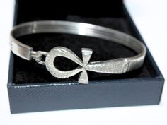 Ankh cross Sterling Silver Bracelet | Key of Life Stamped silver Pharaonic Egyptian Jewelry Cross Bracelet revival jewelry silver Bracelet  Weight Approximate: 16 Gr Lengths:  6.5 in = 16.5 cm 7.5 in = 19 cm 8 in = 20 cm ✔ IT IS Tested & SIGNED WITH THE EGYPTIAN Silver Government HALLMARK FOR Silver to Ensure Authenticity. ✔ Lovely gift idea ABSOLUTELY GORGEOUS, LOOKS FABULOUS ON. ✔ 100% Egyptian handmade. ✔ Condition: A brand-new, exactly as on the photos. ★ GIFTS ✔ All items are packaged in a Silver Symbolic Bracelets For Ceremonial Use, Hallmarked Silver Ankh Jewelry, Silver Ankh Hallmarked Jewelry, Silver Spiritual Bracelet For Ceremonial Occasions, Silver Spiritual Bracelets For Ceremonial Occasions, Nickel Free Silver Cross Bracelets, Nickel-free Silver Cross Bracelets, Silver Nickel-free Cross Bracelet, Symbolic Engraved Sterling Silver Bracelet