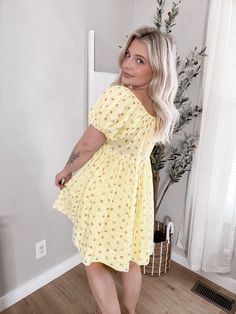 Our Daffodil Floral Dress features a babydoll fit, baby yellow hue with dainty pink and blue floral print, elastic sleeves and neckline with self tie in middle of neckline, fully lined, flowy relaxed fit. Model is 5'1", 34D, 6/28 and is wearing a size small. Item is a relaxed, babydoll style fit. More details: 100% cotton. hand wash or wash on cold and hang to dry. Mable dress Elastic Sleeves, Floral Babydoll Dress, Babydoll Style, Baby Yellow, Blue Floral Print, Babydoll Dress, Dress Romper, Daffodils, Denim Pants