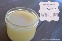 a glass jar filled with liquid sitting on top of a wooden table next to a white sign that says how to make natural hand lotion