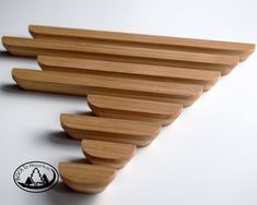 a group of wooden pegs sitting on top of a white table