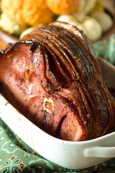 a large piece of meat in a white dish