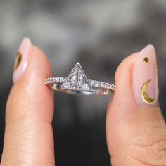 Embrace the mysteries of the ages with our Harry Potter Deathly Hallows Ring. Wear it with caution, for the Deathly Hallows are a promise – a promise of power, a promise of control, and a promise of a darkness that may consume you entirely. He who shall not be named may come looking... Don't say we didn't warn you... Adjustable Mystical Promise Ring, The Deathly Hallows, Harry Potter Deathly Hallows, Be Your Own Hero, Flat Back Earrings, Deathly Hallows, Disney Dream, Retail Therapy, Luxury Shop