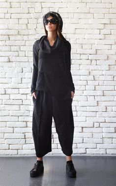 Casual Black Tracksuit - METJ0010 An extravagant urban style black tracksuit with a cut and put back together effect - a must have for a true street style lover. This set consists of maxi pants and a loose tunic which are both very comfortable and easy to wear. No matter where you want to wear it - school, for a coffee or jogging, you cannot go wrong. Pair them with some sneakers for the coolest sports look! This black set is made of 100% cotton. WHEN YOU PLACE AN ORDER YOU MUST LEAVE A TELEPHON Black Activewear With Pockets For Fall, Baggy Black Sweatpants Sportswear, Black Baggy Sweatpants For Sportswear, Black Baggy Sweatpants Sportswear, Black Long Sleeve Activewear For Leisure, Black Sweatpants For Winter Loungewear, Black Winter Tracksuit For Leisure, Black Long Sleeve Leisure Activewear, Black Winter Sweatpants For Loungewear