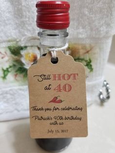 a bottle with a tag on it that says, still hot at 40 thank you for celebrating patrick's fortyth birthday