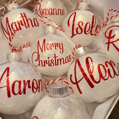 christmas baubles with names on them in a box