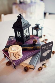 some books and candles on a table