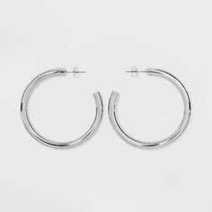 These Tubular Hoop Earrings from A New Day™ will add a shiny staple to your jewelry collection. These silver-tone hoop earrings feature a tubular design, and the versatile size makes them perfect for work, casual days and date night. Plus, the post-back closures keep the earrings secure on the ear no matter where your day or night takes you. 

A New Day™: Style that goes wherever you do. Stud Earrings Set, Retro Floral, Silver Hoops, Work Casual, A New Day, New Day, Earring Set, Date Night, Jewelry Collection