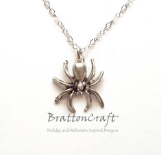 I love this Silver Spider Necklace! The charm is made of pewter, has an antique silver finish and is made in the USA. The spider is 5/8 inches long and 5/8 inches wide. The chain shown is 18 inches long, sterling silver, with a lobster claw clasp. A 16 inch chain is available and may be selected at check out. This creepy, crawly spider is ready to ship and will arrive in a gift box. I can make this necklace for a man with a custom length chain and larger link. Contact me to make something specia Silver Jewelry With Oxidized Finish For Halloween, Antique Silver Jewelry For Halloween Gift, Themed Silver Necklaces For Halloween, Silver Novelty Jewelry For Halloween, Silver Themed Necklace For Halloween, Halloween Themed Silver Necklaces, Silver Themed Halloween Necklace, Silver Charms Necklace For Halloween, Spider Web Chain Necklace