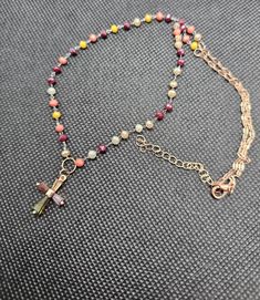 Add a splash of color and spirituality to your accessory collection with our handmade multicolor beaded cross necklace. This unique piece is meticulously crafted with a variety of autumn-toned beads, creating a vibrant and eye-catching design. The delicate cross pendant features a mix of colors (burgundy, yellow, orange, green, purple, coral and white) that perfectly complements the beaded chain, making it a versatile and meaningful accessory. Free shipping excludes Hawaii, Alaska and internatio Christian Rosary, Purple Coral, Autumn Tones, Chain Making, Jaune Orange, Beaded Cross, Rosary Beads, Bead Chain, Religious Gifts