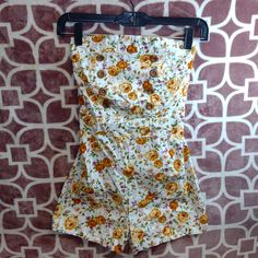 Nwot Super Adorable Floral Shorts/Tube Top Romper. Size Small In Women's Wooden Accent Buttons On The Front Near Bust. Zips Up The Back Halfway. Across The Top: 11.5" Waist: 12" Perfect Condition Comes From Smoking And Pet Free Home Come Check Out My Other Listings In My Closet Bundle And Save Vintage White Jumpsuits And Rompers For Spring, White Lined Bottoms For Summer, White Cotton Jumpsuits And Rompers With Floral Print, White Lined Summer Bottoms, Fitted Summer Cotton Jumpsuits And Rompers, Fitted Cotton Summer Jumpsuits And Rompers, Fitted Cotton Jumpsuits And Rompers For Summer, Tube Top And Shorts, Tube Top Romper