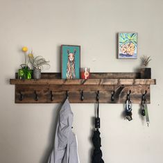 a coat rack with umbrellas and other items on it