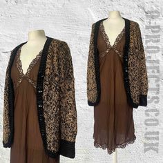 "Vintage 1990s hand knitted brown cardigan, oversized, black crochet edging, marl, boho grunge, hippie, punk, Grandma, cottage core, 8,10,12,14,16? Please check measurements. Unique hand knitted cardigan with crochet stitch borders and cuffs. Button front opening with curved hem at front.  I'm not sure of the yarn content, but would guess its a wool/acrylic mix? Buttons are large, black and glossy! It's fairly heavy and very cosy! Freshly laundered and ready to wear! Photographed on a size 10/12  dummy. MEASUREMENTS ALL APPROXIMATE: Pit to pit:  21\" Hem at back: 22\" Length: 25\" Side seam length: 18\" Shoulder to shoulder: 17\" Sleeve length: 25\" Cuff flat: 3 1/2\" Any questions, extra measurements or photos required -  please ask! Thanks... Ann This garment is true vintage so please be Black Bohemian Knit Cardigan, Black Bohemian Knit Outerwear, Bohemian Black Knit Outerwear, Vintage Fall Festival Cardigan, Oversized Brown Bohemian Cardigan, Winter Cardigan With Lace Trim For Layering, Winter Layering Cardigan With Lace Trim, Winter Lace Trim Cardigan For Layering, Vintage Brown V-neck Cardigan