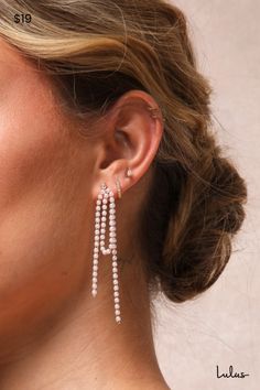 It's easy to fall under the spell of a chic accessory like the Lulus Dainty Charisma Gold and White Rhinestone Pearl Fringe Earrings! These elegant earrings have a unique design, with sparkling rhinestone posts that support a length of looped chain, lined with faux pearl beads. Dangling ends bring movement and life to these elegant earrings. Post backs. 2. 75" Long. 25% Brass, 5% Cubic Zirconia, 70% Acrylic Pearl. Imported. Lulus | Dainty Charisma Gold and White Rhinestone Pearl Fringe Earrings. Pearl Fringe, Pearl Trend, The Spell, Faux Pearl Earrings, White Rhinestone, Chic Accessories, Accessories Jewelry Earrings, Pearl Chain, Fringe Earrings