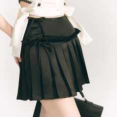 Pleated short skirt made of slightly glossy satin fabric. The waist part is decorated with a ribbon. The pleats hang from the middle of the skirt, giving it a sophisticated look. Goes great with short tops. 
 
 
 Size 
 
 S size 
 
 Total length: 38cm 
 Waist: 62cm 
 
 M size 
 
 Total length: 38.5cm 
 Waist: 66cm 
 
 L size 
 
 Total length: 39cm 
 Waist: 70cm 
 
 
 
 
 
 
 
 
 
 Material 
 
 Polyester 
 
 
 Model worn 
 
 Wearing size 
 
 S size 
 
 Model dimensions 
 
 Height: 163cm 
 Weight: Flared Accordion Pleated Skirt For Party, Flared Pleated Skirt With Accordion Pleats For Party, Elegant Pleated Mini Skirt For Party, Party Mini Skirt With Pleated Hem, Elegant Party Mini Skirt With Pleated Hem, Elegant Pleated Mini Tennis Skirt, Elegant Pleated Tiered Skort, Elegant Tiered Pleated Skort, Spring Pleated Satin Skirt