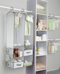 an organized closet with baby clothes and toys