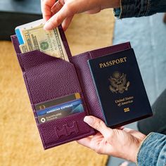 a person holding a passport and a wallet