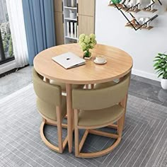 a round table with three chairs around it