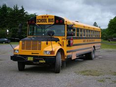 a yellow school bus parked in a parking lot