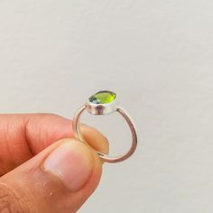 "Important : PLEASE ENTER YOUR PHONE NUMBER IN THE \"NOTE TO SELLER\" SECTION DURING CHECKOUT, SO THAT THE DELIVERY CAN BE HASSLE FREE. Stone : Peridot Metal : 925 Sterling Silver Stone Size : Varies(According to the ring size) Shape : OVAL Ships Worldwide from India 925 stamped Handmade Item ABOUT PERIDOT ♥ Healing ♥ Renewal ♥ Purification ♥ Rebirth ♥ Growth ♥ Relaxation ♥ Comfort ♥ Intuition Peridot is a powerful cleanser. It releases and neutralises toxins on all levels. Alleviates jealousy, Handmade Silver Rings, Peridot Rings, Rings Sterling Silver, Handmade Silver Ring, Rings Handmade, Natural Gemstone Ring, Peridot Stone, Rainbow Moonstone Ring, Peridot Ring