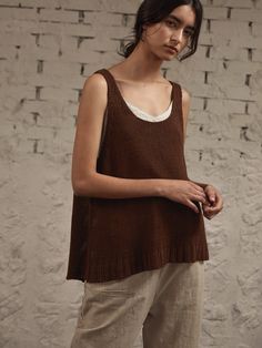 Editor's notesThis oversized vest features a deep U-neckline, raw back-hem, and falls long and loosely over the body.- Scoop neck- Sleeveless- A-line knit top- Deep armhole- Raw back-hem- Chunky knit textureMeasurements(in.)- Size: One size(XS-M)- Length: 24.02in- Shoulder: 14.17in- Chest: 26.38in- Armhole: 9.84in- Hem: 30.32inComposition & Care- 100% Linen- Hand wash coldDesigner- by ho'me Sleeveless Relaxed Fit Top For Fall, Chic Oversized Sleeveless Top, Sleeveless Knit Tops With Relaxed Fit, Chic Scoop Neck Tank Top For Fall, Everyday Sleeveless Knit Top For Fall, Oversized Sleeveless Tops For Layering, Relaxed Fit Sleeveless Vest For Fall, Brown Vest Top For Layering, Oversized Sleeveless Sweater Vest For Spring