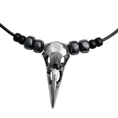 DragonWeave Large Silver Raven Skull Pendant on Beaded Black Leather Cord Necklace - 16" to 19" - spooky beaded tribal Halloween raven skull necklace - black leather cord, adjustable length - comes gift boxed, with lifetime warranty  Large Silver Raven Skull Pendant on Beaded Black Leather Cord Necklace, adjustable from 16" to 19". Bold raven skull necklace with a tribal feel, featuring a large shiny silver-finished zinc alloy three dimensional raven skull pendant, 41mm (1.6") by 18mm (0.7"). The raven skull pendant is strung on a 2mm fine black leather cord with silver-finished ends and lobster claw clasp. Necklace is 16" long with an extra long 3" silver-finished extender chain. On either side of the raven skull are 6mm black and 9mm gunmetal Czech glass pony beads (also called crow bead Halloween Raven, Raven Skull Necklace, Leather Cord Necklace, Raven Skull, Leather Corded Necklace, Skull Necklace, Skull Pendant, Necklace Black, Pony Beads