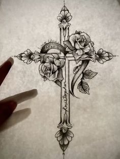 a cross with roses on it is shown