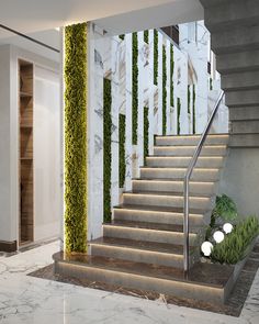 the stairs are decorated with green plants and white marble walls, along with an illuminated planter