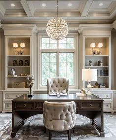 an elegant home office with chandelier, desk and chair in front of large windows