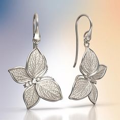 Experience Italian craftsmanship at its finest with our exquisite gold dangle drop earrings. The centerpiece of these earrings is a delicate butterfly with elegantly crafted leaves as its wings, creating a captivating and nature-inspired design. Available in both 14k and 18k gold, these earrings bring a touch of luxury and nature's beauty to your style. Elevate your look with the perfect blend of Italian artistry and organic elegance, shop now to adorn yourself with this unique masterpiece. 14k Elegant Butterfly Filigree Jewelry, Silver Filigree Butterfly Jewelry, Luxury Yellow Gold Butterfly Earrings, Butterfly-shaped Filigree Jewelry Gift, Gold Butterfly-shaped Sterling Silver Earrings, Italian Jewelry, Gold Butterfly, Nature Inspired Design, Gold Earrings Dangle