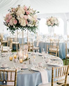 the tables are set with white and blue linens