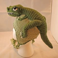 a crocheted hat with an alligator on it