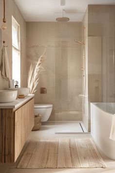 a bathroom with a toilet, sink and bathtub next to a window in it