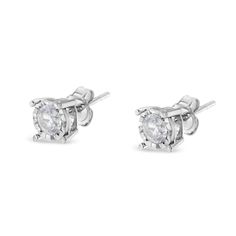 Celebrate any occasion with these classic shimmering diamond stud earrings. Fashioned in .925 sterling silver, each earring showcases a sparkling Ã‚Â¼ carat round, brilliant cut, miracle-set diamond solitaire. The unique miracle-plate setting centers each genuine diamond in a mirror-finish, high-polish frame, giving the illusion of a much larger stone. Dazzling with a bright polished shine, these post earrings secure comfortably with friction posts and butterfly backs. This authentic design is c Affirmation Jewelry, Colorless Diamond, Classic Earrings, Diamond Stud Earrings, Tech Gifts, Diamond Stud, Chains For Men, Round Brilliant Cut Diamond, Round Cut Diamond