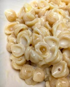 macaroni and cheese is sitting on a white plate