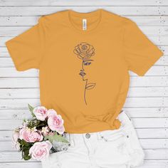 flower shirt, floral shirt, tshirt women, aesthetic shirt, gifts for her, trendy shirts, teen girl shirt 👕 Wonderful t-shirt will create a fascinating look! Perfect gift for girls and women. This floral t shirt will become the favorite part of your outfit! ►CLASSIC FIT Our unisex T-shirts are true to size. Look amazing with our graphic tee! Due to the comfortable fitting, the floral print T-shirt will favorably accentuate your figure. Great for sports, outdoor activities, etc. Made from soft and breathable material that is pleasant to the skin! ►COOL GIFT Give your family members or friends a floral shirt, impress them! The flower T-shirt is a unique gift for any occasion: * Birthday * Christmas * Graduation * Anniversary * Halloween, etc. ►DETAILS * Unisex * For kids and adults * Premium Trendy Short Sleeve Shirt With Plant Print, Summer Short Sleeve T-shirt With Rose Print, Summer Rose Print Short Sleeve T-shirt, Spring Rose Print Short Sleeve T-shirt, Spring Cotton T-shirt With Rose Print, Trendy Rose Print T-shirt For Spring, Printed Relaxed Fit Tops As Gifts, Relaxed Fit Printed Tops As Gifts, Cotton Crew Neck Top With Rose Print