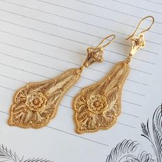 Beautifully crafted Victorian earrings circa 1895. Originally they had screw-back fittings but we replaced those with 18k shepard's hook wires. Perfect as a boho wedding accessory, as well as a signature statement, they have a seductive dance on the ear as the bottom pendant sways with the wearer's movement. Measuring approximately 3" long from top of the ear wire curve to bottom of the drop. Not marked for metal content, the earrings themselves are 16k, XRF tested to confirm, the wires are 18k. Filigree Earrings Gold, Gold Pendant Set, Turkish Gold Jewelry, Boho Wedding Accessories, Gold Necklace Wedding, Gold Jewels Design, Gold Filigree Earrings, New Gold Jewellery Designs, Neck Pieces Jewelry