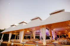 an outdoor wedding venue with tables and chairs