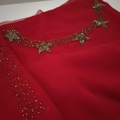 a red dress with gold stars on it