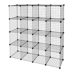 a large metal cage with six sections and four black dots on the front, one section is