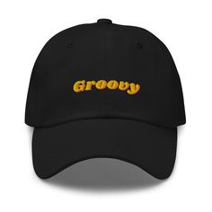 Step back in time with this retro 'Groovy' embroidered black cap, the perfect accessory for any vintage enthusiast. Crafted with high-quality materials, this classic dad hat combines modern comfort with a nostalgic flair. The vibrant yellow and orange 'Groovy' text stands out beautifully against the sleek black fabric, making it a stylish addition to any casual outfit. Features: - High-quality embroidery - Adjustable strap for a perfect fit - Comfortable and durable fabric - Ideal for casual wea Retro Trucker Hat With Curved Visor, Retro Trucker Hat With Embroidered Logo, Vintage Black Trucker Hat With Embroidered Logo, Retro Baseball Cap With Curved Visor, Black Retro Trucker Hat, Retro Dad Hat With Curved Brim, Retro Snapback Dad Hat, Retro Black Baseball Cap With Embroidered Logo, Retro Hats With Embroidered Logo And Curved Bill